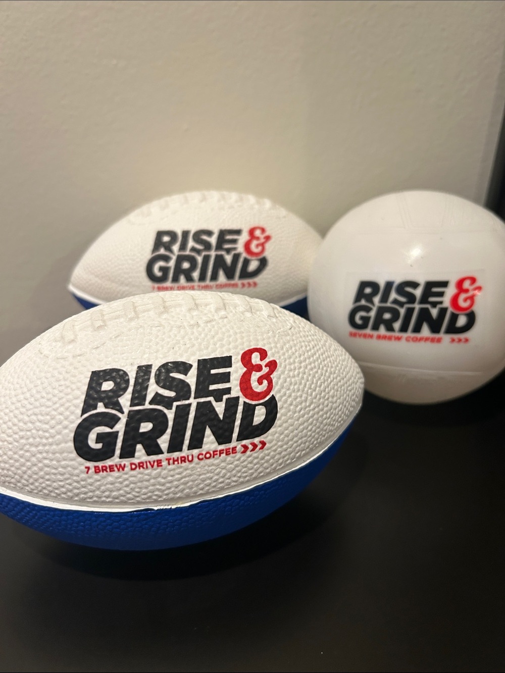 Rise & Grind Branded Stress Footballs - White & Blue